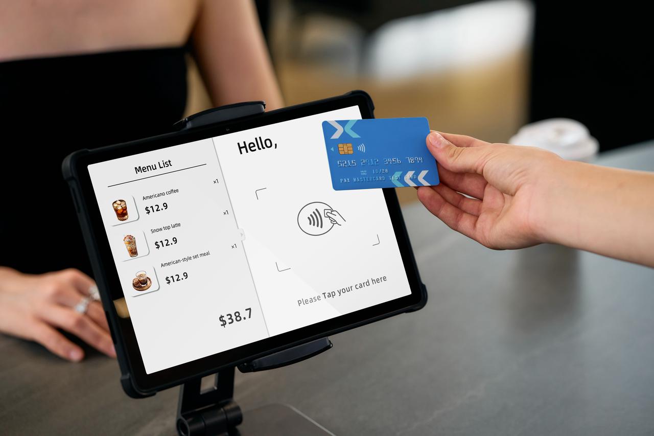 M8100 retail checkout with under-display NFC tap-to-pay